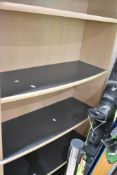 A modern laminate full height bookshelf, beech effect