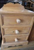 A natural pine three drawer bedside chest, width approx. 46cm