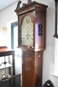 A late 19th or early 20th Century mahogany long case clock , having eight day movement, the