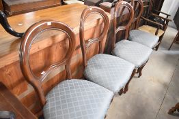 A set of four reproduction balloon back dining chairs