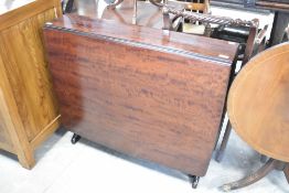 A modern mahogany Stag style Sutherland table, width approx. 89cm