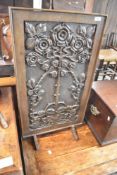 A traditional fire screen having carved foliate panel. Approx width 46cm