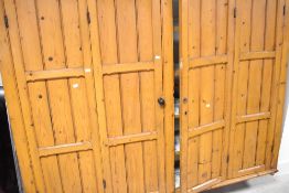 A Victorian pitch pine quadruple wall cabinet having double bi-fold doors, width approx. 190cm