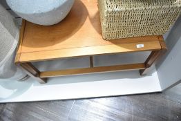 A vintage teak coffee table in the mid century style, approx. 80 x 49cm