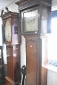A 19th Century and later oak long cased clock having 30 hr movement with painted dial named Heywood,
