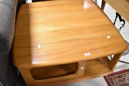 A vintage Ercol stylised coffee table in the Golden Dawn pandora style, having two drawers,