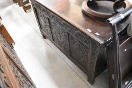 A period oak kist having carved front panel, width approx. 119cm