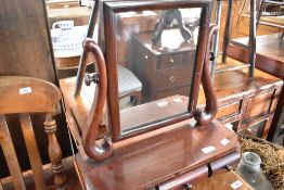 A Victorian mahogany toilet mirror having three trinket drawers, width 45cm