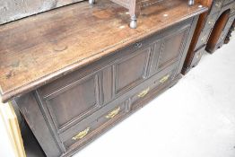 A 19th Century oak kist having drawer base with brass drop Georgian style handles, width approx.