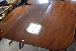 An interesting 19th Century twin pedestal dining table , having Regency supports, associated top