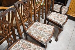 A set of four (three plus one) Chippendale revival style mahogany dining chairs having ball and claw