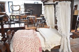 A 19th Century mahogany framed dolls or specimen half tester bed, with bedding including patchwork