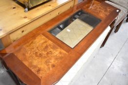 A reproduction console table having glass insert, width approx. 122cm