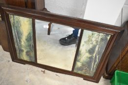 A triptych pictorial wall mirror, width approx. 91cm