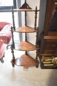 A Victorian walnut and inlaid corner whatnot
