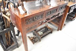 An Oriental hardwood console table, width approx. 126cm