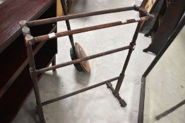 A traditional warming pan and towel rail
