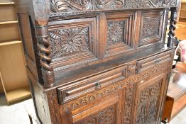 A period oak court cupboard of nice proportions , carving include date 1700, and monogram IW,