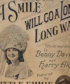 A collection of nine early 20th century framed sheet music covers, each with text and pictorial