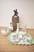 An eight piece dressing table set in green with pink rose decoration including three trinket