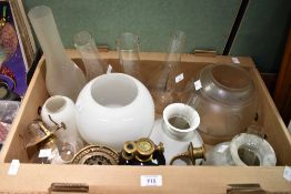 A selection of oil lamp spares including shades, chimneys and chambers etc