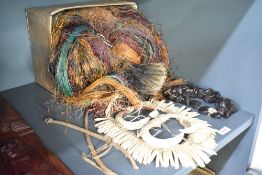 A pulpus grass skirt from Papua New Guinea, L 70cm, sold together with various teeth and seed