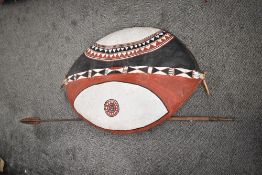 A African oval sheild, hand decorated on buffalo skin with geometrical patterns, L90cm Condition
