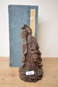An early 20th century Chinese wooden carving having carved female figure with a boy by her side,