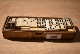 An almost complete set (54) double nine small bone dominoes