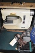 A Cresta Five Star vintage sewing machine in carry case.