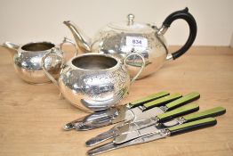 A silver plated tea pot, sold together with 6 Zenith butter knives a cream jug and a twin handled