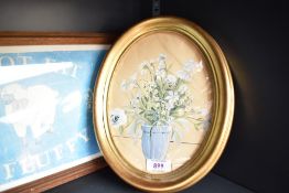 A handpainted still life depicting flowers in a vase in oval frame 28m x 22cm sold along with a