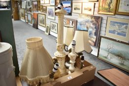 A collection of seven assorted lamps and lamp bases