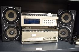A Hitachi Portable Video Cassette Recorder VT-6500E, a Hitachei video tuner TU65E and a pair of
