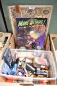 A miscellaneous collection of items including a copy of Mars Attacks - The Art of the Movie, a small