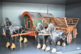 A pair of hand made wooden horse and wagons