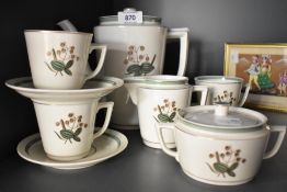A Royal Copenhagen tea service decorated with foliage and gilt edging on an ice white ground, makers