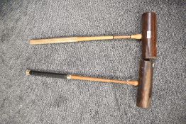 A pair of early 20th century Slazenger 'Corbally' croquet mallets, L77cm, (2).
