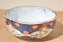 A decorative Japanese Imari porcelain bowl, of lobed circular form and decorated in the typical