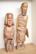 A pair of wooden African sculptures, hand carved with shield, missing spear, largest h63cm, ( 2 ).