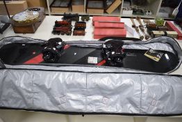 A Modern Ride Snow Board Decade Series, in a Snow + Rock Canvas Carry Case