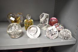 A glass heart shaped paperweight signed to base 'G.S', h11cm, sold together with a Millefiori flower