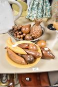 A small assortment of vintage wooden carved fruits including pineapple, grapes and bananas etc.