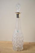 A George V silver mounted cut glass decanter, of slightly bulbous form, marks for Sheffield 1929,