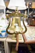 A vintage cast iron ships bell, measuring 35cm tall.