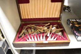 A oak canteen having red felt interior containing stainless steel cutlery, (55)