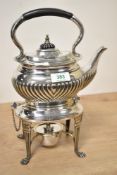 A silver-plated spirit kettle on stand, of rounded rectangular form with half-gadrooned