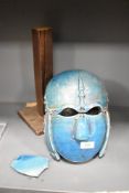 An early 20th century ceramic reproduction Angelo Saxon helmet having suspended parts in a blue