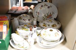 A Royal Worcester Evesham pattern porcelain dinner part service, decorated with gold colour edging