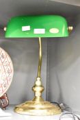 A 20th century bankers lamp having green glass shade, h35cm